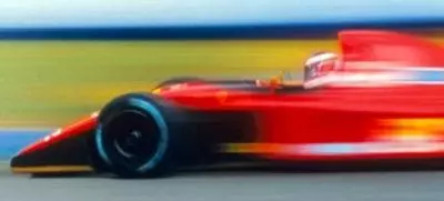 Long Exposure of Red F1 Car Driving