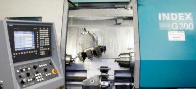 A view of the control panel and inside of an Index G300 machine