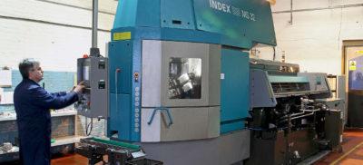 An engineer working with an Index CNC machine