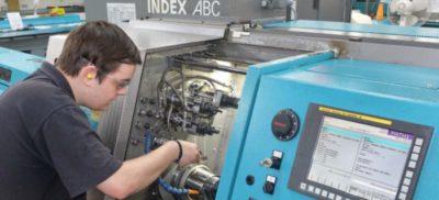 Engineer working next to a Index machine