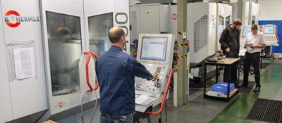 An engineer programming a Hermle machine