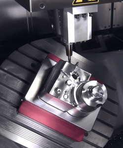 A metal component being machined close-up