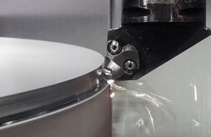 A metal component being machined close-up