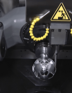 A metal component being machined close-up