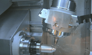 A metal component being machined close-up