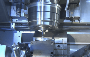 A metal component being machined close-up
