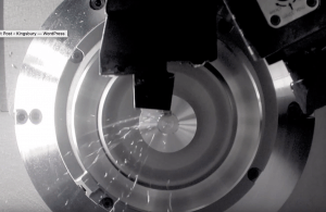 A metal component being machined close-up