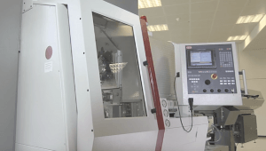 The side view of a CNC machine and control panel