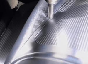 A metal component being machined close-up