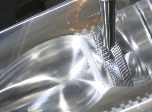 A metal component being machined close-up