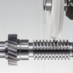 A close up of a metal component being machined