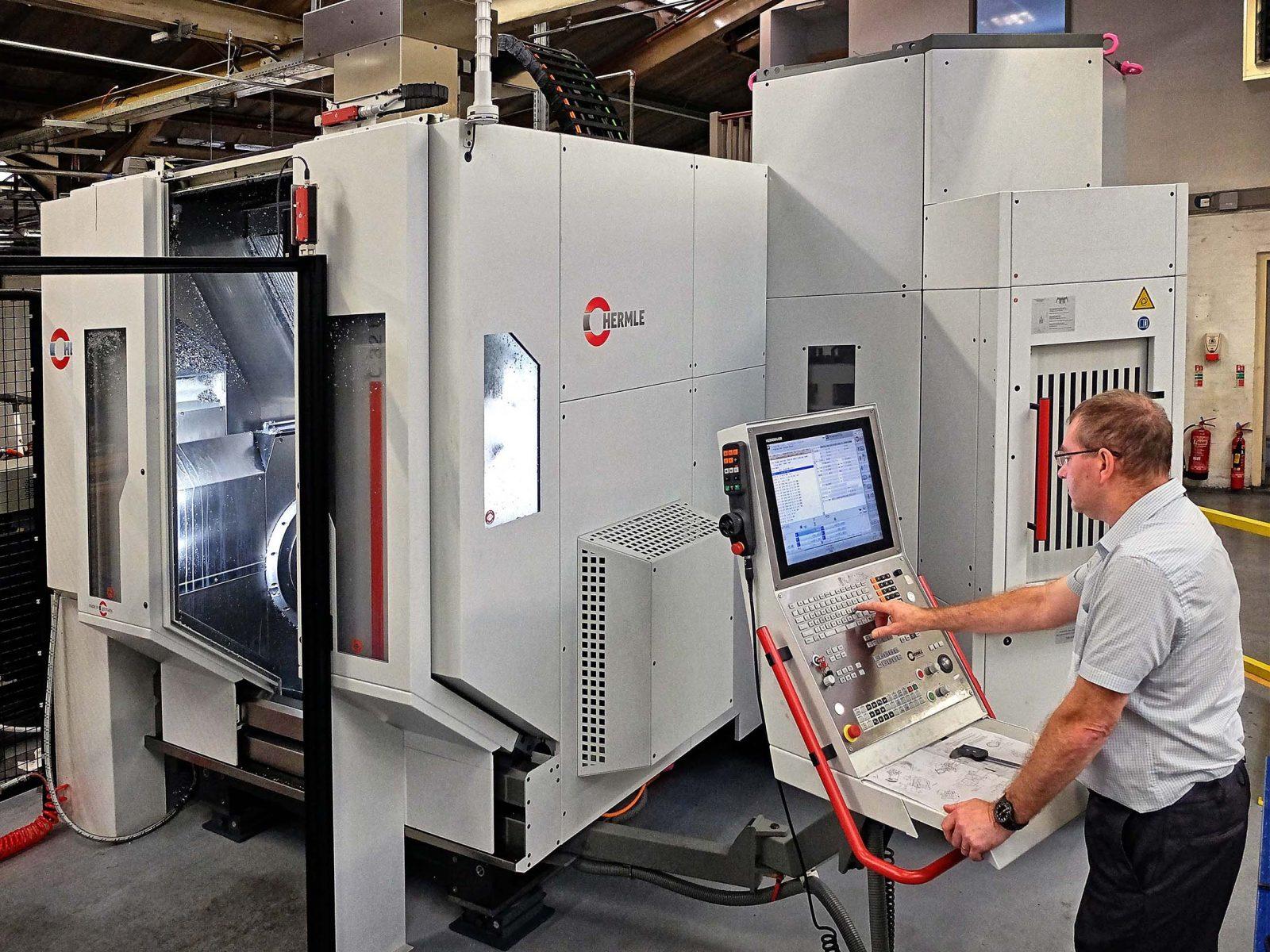 technician operating Hermle machine