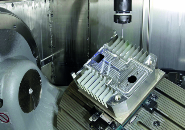 a close up image of a 5 axis machine