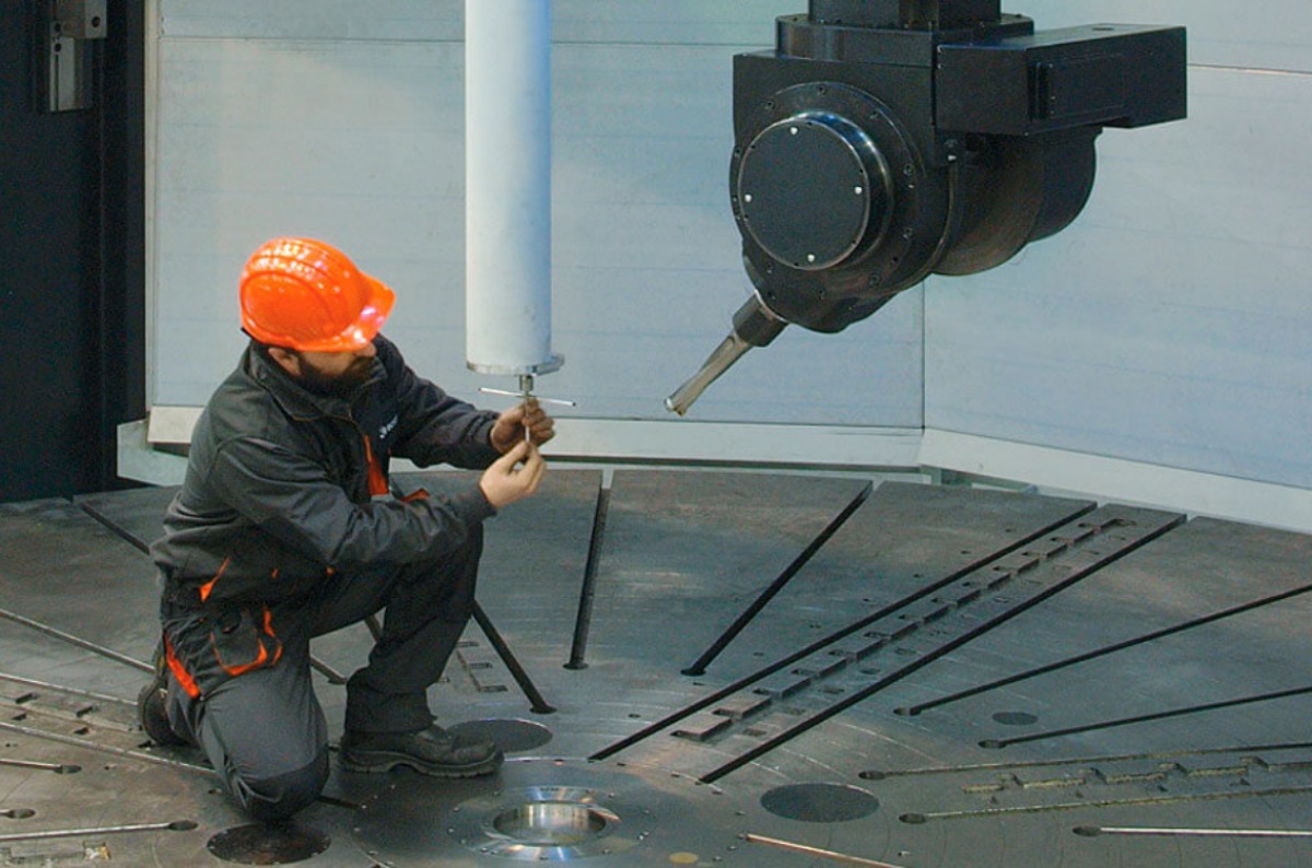 Bost CNC machine with engineer working on it