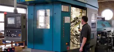 An engineer working on a CNC Machine