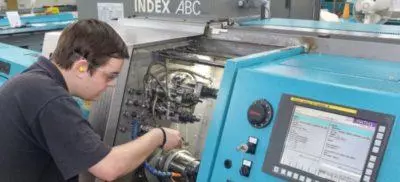Engineer working next to a Index machine