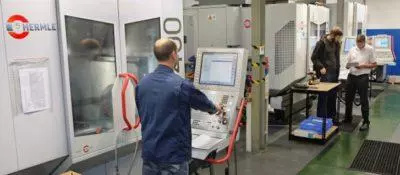 An engineer programming a Hermle machine