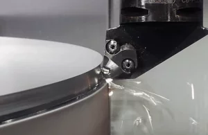 A metal component being machined close-up