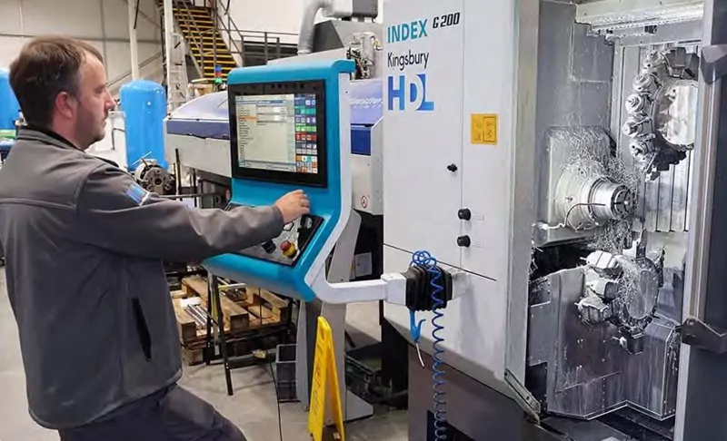 Index Machine with Engineer working on it