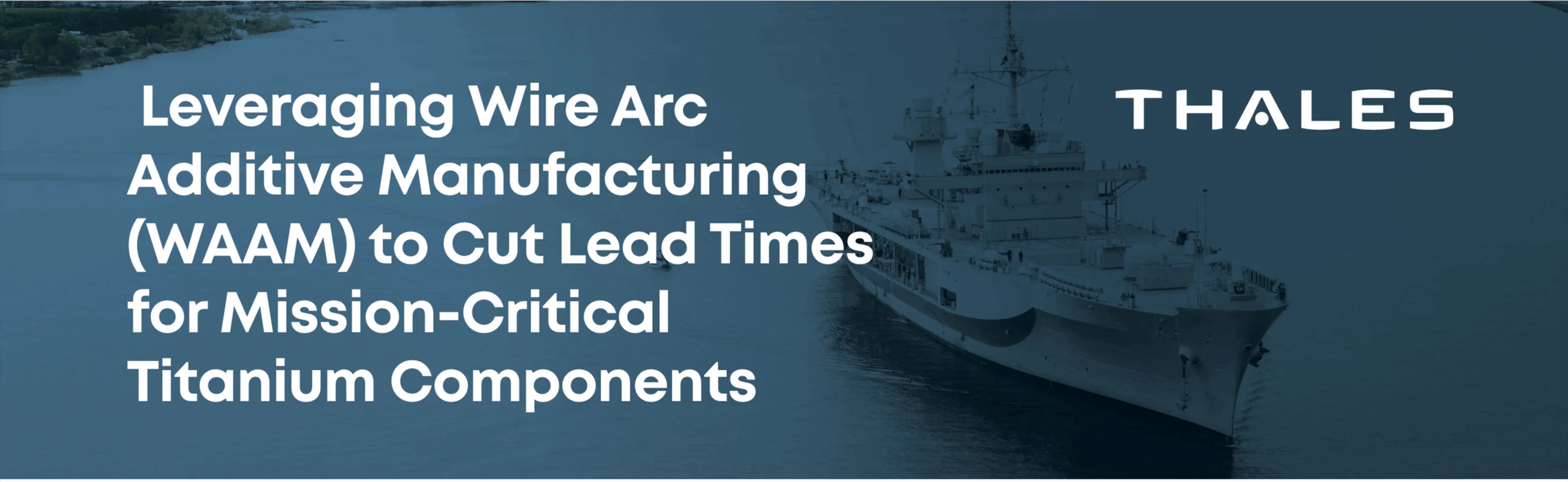 A large ship in the background with Thales logo on top